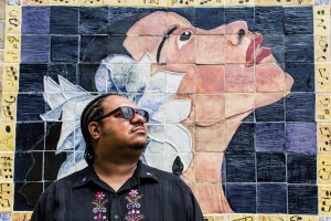 Troy Burton, executive director of the Eubie Blake Center, in front of its famed Billie Holiday mural.