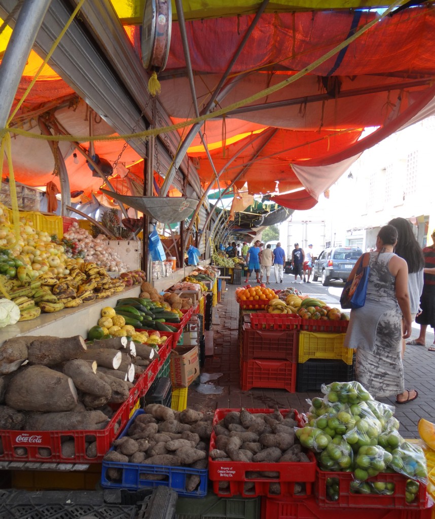 Open-air shopping and fresh produce on the streets of Curacao.
