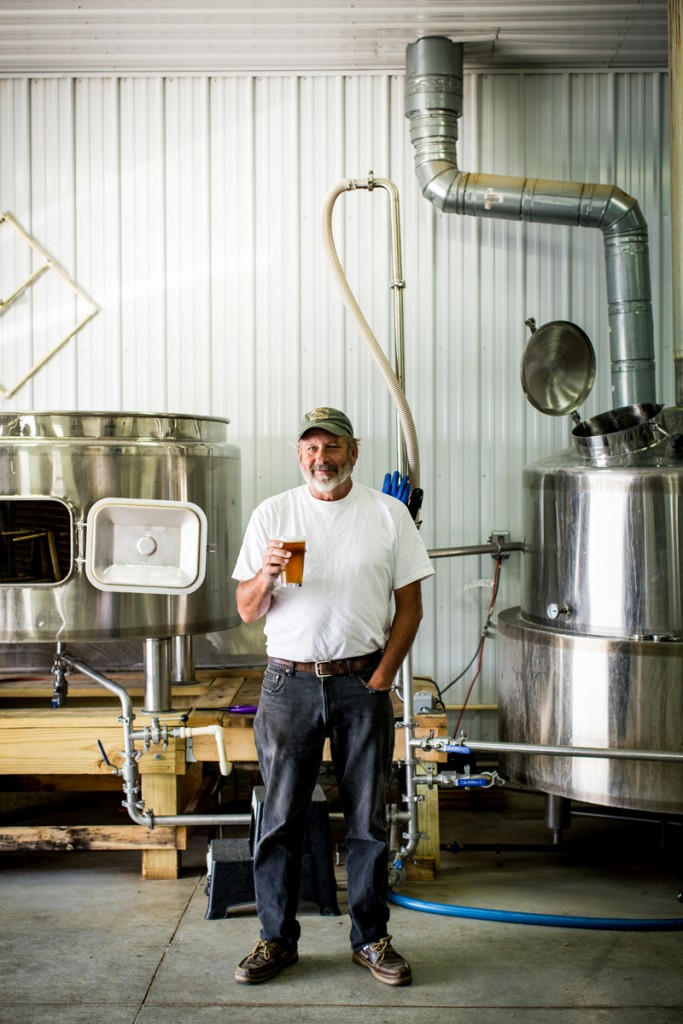 Tom Barse, founder of Milkhouse Brewery at Stillpoint Farm, with a glass of Goldie’s Bitter.