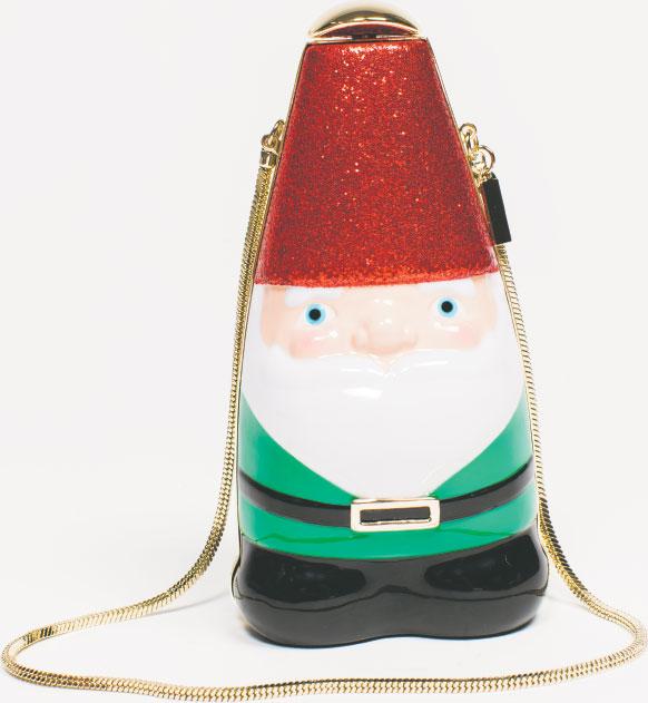 JUST SAY GNOME The Kate Spade Blaze a Trail Gnome Clutch reminds us of specialty party purses our grandly attired grandmother used to own. $398, at Handbags in the City in Harbor East.
