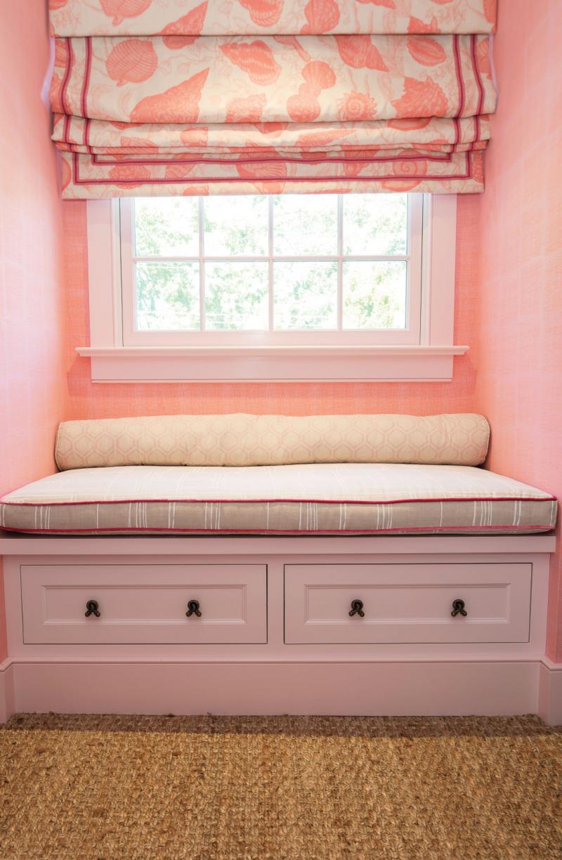 A sweet window seat in the little girl’s room features Christopher Farr fabric with Quadrille velvet welting 