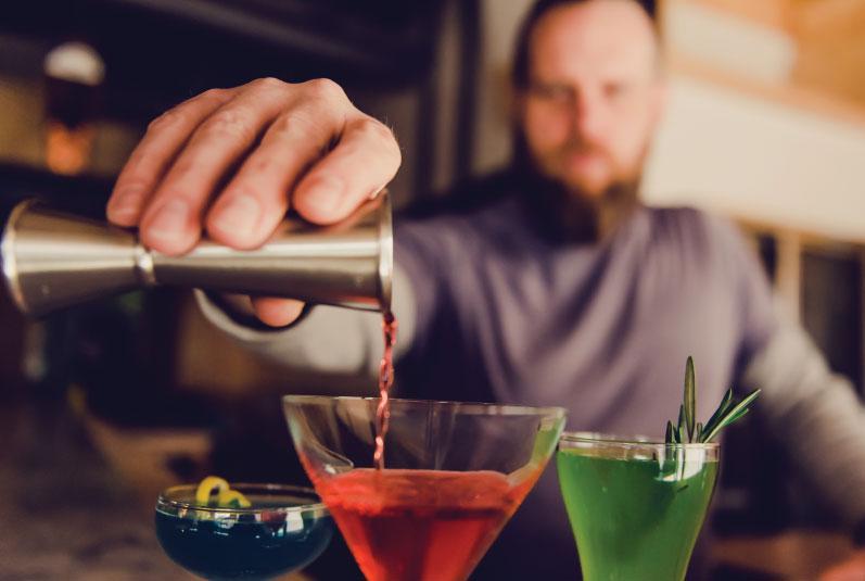 bar manager Ian Clark pours classic cocktails