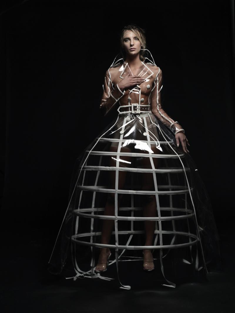 JILL ANDREWS This cheeky see-through raincoat was created to fit over a wedding gown. We love the way Andrews summons femininity as a muse, but architecture as well. Made to order. jillandrewsgowns.com
