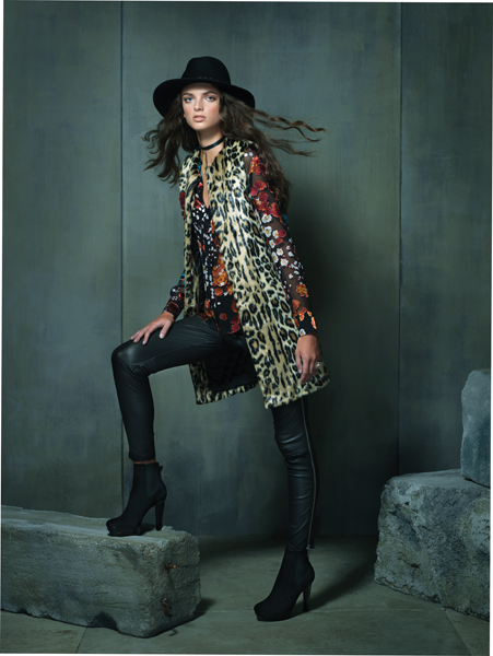 Urban Jungle Sheer floral print blouse, $495; faux fur vest, $390; both by Alice + Olivia at Neiman Marcus, Tysons Galleria. Black leather leggings with side zipper by Vince, $1,095 at L'Apparenza, Falls Road. Black maxi fedora by Eugenia Kim, $375 at Neiman Marcus, Tysons Galleria. Black suede platform booties by Robert Clergerie, $675 at Ruth Shaw, Cross Keys. Black leather choker with gold chain by FordamRowe, $45 at Katwalk Boutique, Fells Point. Gold orb “Copernicus” ring, by H. Stern Jewelers, $7,500 at Radcliffe Jewelers, Pikesville.