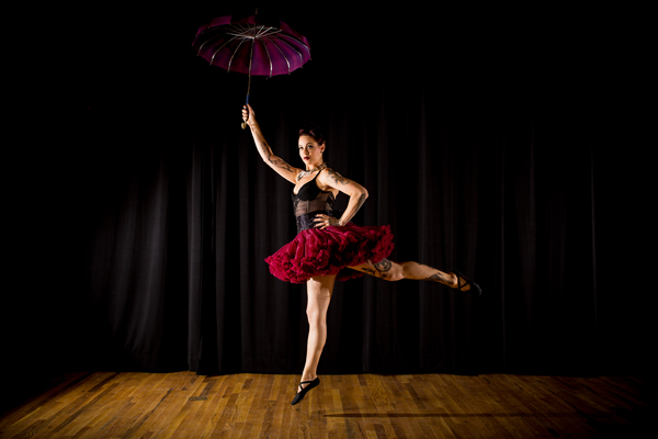 Parasol Dancer: Abby Stone from The Ideal Arts Space “is an instructor, performer and creative director. Her passion for all things movement related is reflected in her pose as a turn-of-the-century parasol dancer,” notes calendar text.